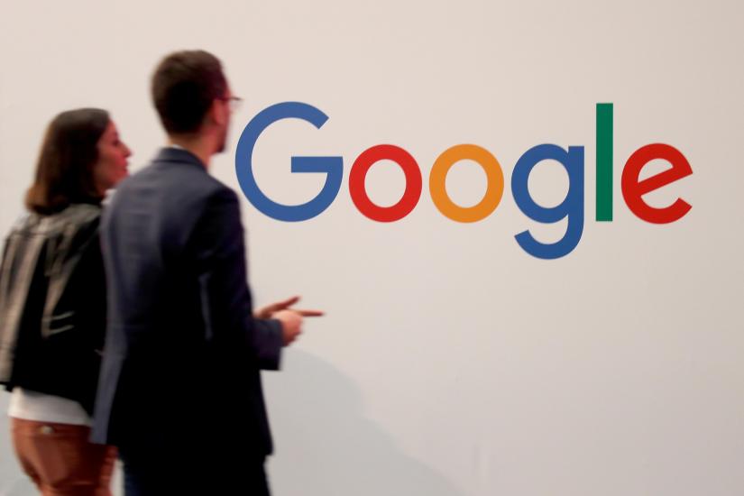 Visitors pass by the logo of Google at the high profile startups and high tech leaders gathering, Viva Tech,in Paris, France May 16, 2019. REUTERS/File Photo