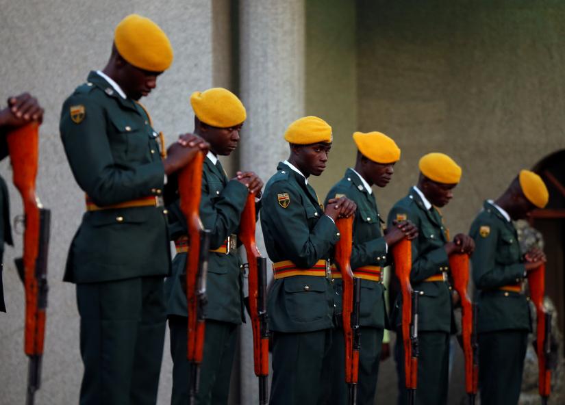Members of the Presidential Guard are seen at Zimbabwean former President Robert Mugabe`s `Blue Roof` residence in Borrowdale, Harare, Zimbabwe, September 11, 2019. REUTERS