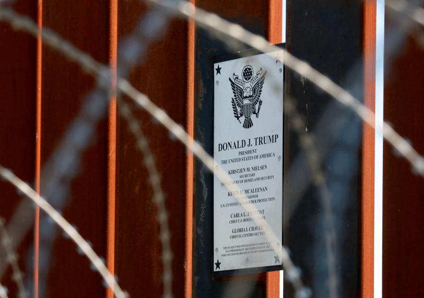FILE PHOTO: A plaque commemorating U.S. President Donald Trump hangs on the U.S.-Mexico border fence as Trump visits the U.S.-Mexico border in Calexico, California, U.S., April 5, 2019. REUTERS