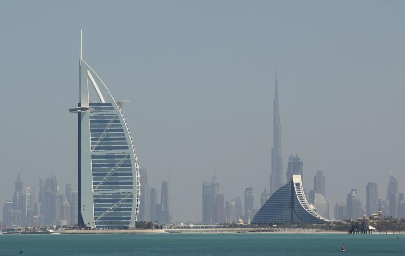 The Burj Al Arab (L) and the Burj Khalifa (rear), the world`s tallest tower at a height of 828 metres (2,717 ft), stand in Dubai March 5, 2012. REUTERS/File Photo