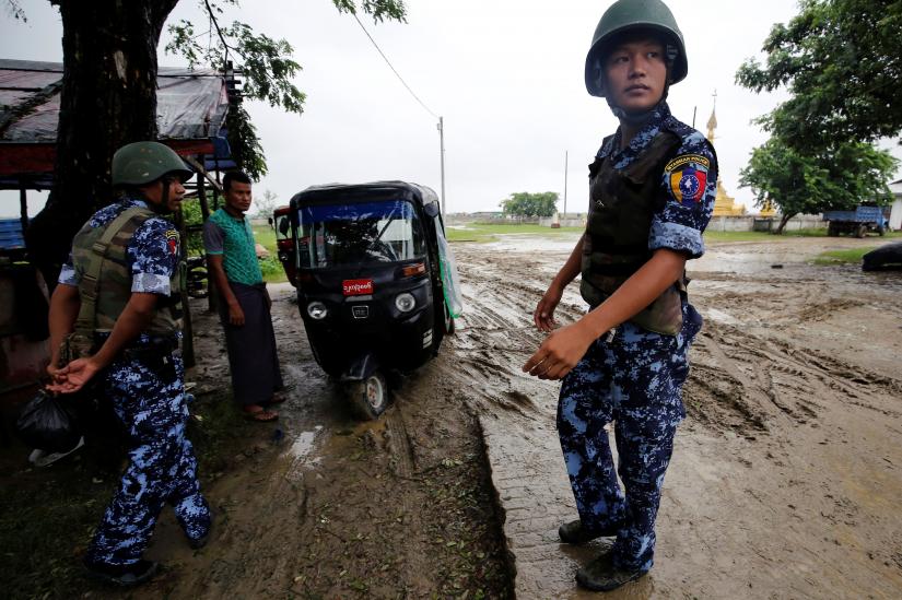 Myanmar police officer stands guard in Maungdaw, Rakhine July 9, 2019. Photo taken on July 9, 2019. REUTERS