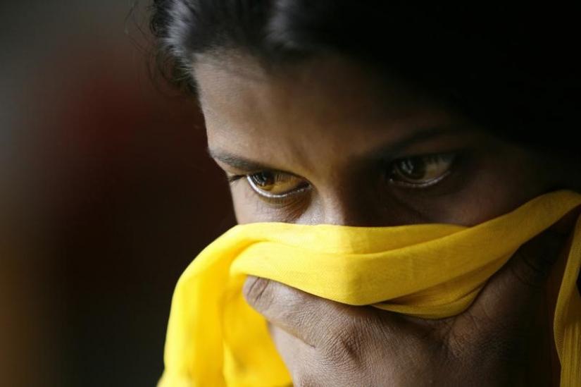 A 18-year-old girl rescued from child trafficking poses in Proshanti, a shelter run by the Bangladesh National Women Lawyers Association in Dhaka, June 17, 2008. The girl was trafficked by her aunt and then forced to work in a brothel in Mumbai for one and a half years. REUTERS