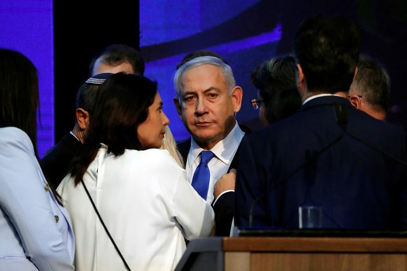Israeli Prime Minister Benjamin Netanyahu looks on after speaking to supporters at his Likud party headquarters following the announcement of exit polls during Israel`s parliamentary election in Tel Aviv, Israel Sept 18, 2019. REUTERS
