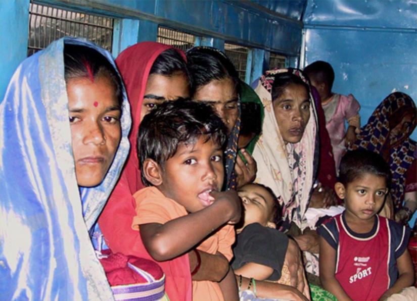 This undated photo shows Bangladeshi women and children sitting  inside a crowded police van before appearing in court in Howrah, some 20 km (12 miles) west of the eastern Indian city of Kolkata. REUTERS/File Photo
