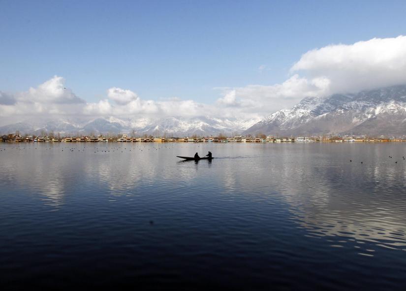 A man rows a small boat on the waters of Dal Lake on a sunny day in Srinagar February 4, 2015. REUTERS/File Photo