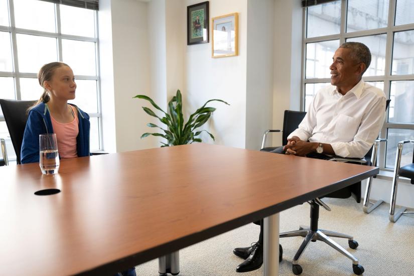 Former US President Barack Obama talks with Greta Thunberg during a meeting at his personal office in Washington, D.C., US, September 16, 2019. Obama Foundation/Handout via REUTERS