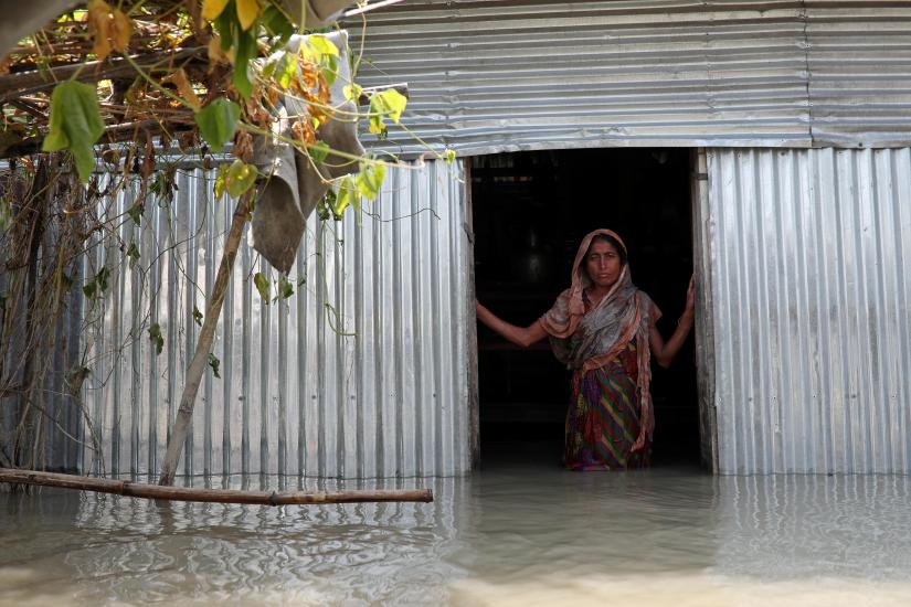 Saju Begum, a flood-affected woman poses for a picture inside her house in Jamalpur, Bangladesh, July 21, 2019. REUTERS/File Photo