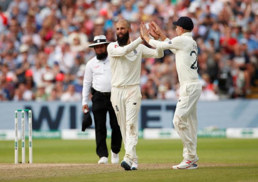 England`s Moeen Ali celebrates taking the wicket of Australia`s Tim Paine Action Images via Reuters