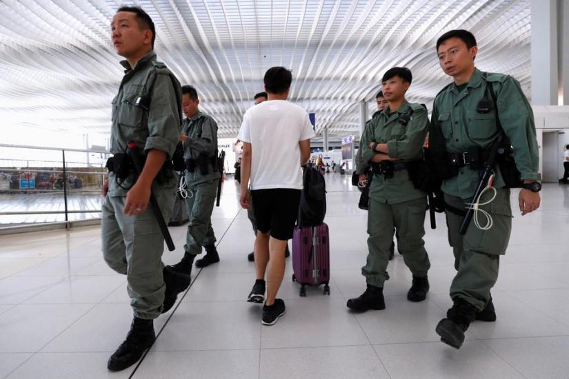 Riot police patrol inside Hong Kong International Airport in Hong Kong, China Sept 22, 2019. REUTERS