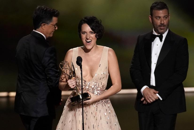 71st Primetime Emmy Awards - Show - Los Angeles, California, US, Sept 22, 2019. Phoebe Waller-Bridge accepts the award for Lead Actress in a Comedy Series for `Fleabag.` from presenters Stephen Colbert (L) and Jimmy Kimmel. REUTERS