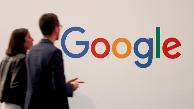 FILE PHOTO: Visitors pass by the logo of Google at the high profile startups and high tech leaders gathering, Viva Tech,in Paris, France May 16, 2019. REUTERS