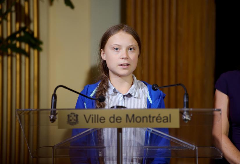 Climate change teen activist Greta Thunberg speaks as she receives the key to the city from Montreal Mayor Valerie Plante after a climate strike march in Montreal, Quebec, Canada September 27, 2019. REUTERS