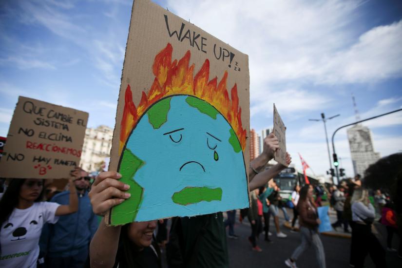 Activists hold placars as they participate in a Fridays for Future march calling for urgent measures to combat climate change in Buenos Aires, Argentina, September 27, 2019. REUTERS