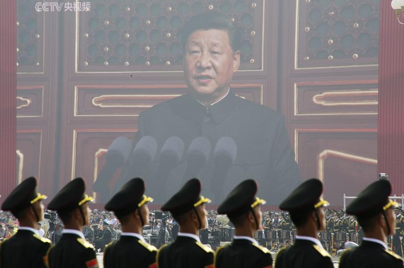 Soldiers of People`s Liberation Army (PLA) are seen before a giant screen as Chinese President Xi Jinping speaks at the military parade marking the 70th founding anniversary of People`s Republic of China, on its National Day in Beijing, China Oct 1, 2019. REUTERS
