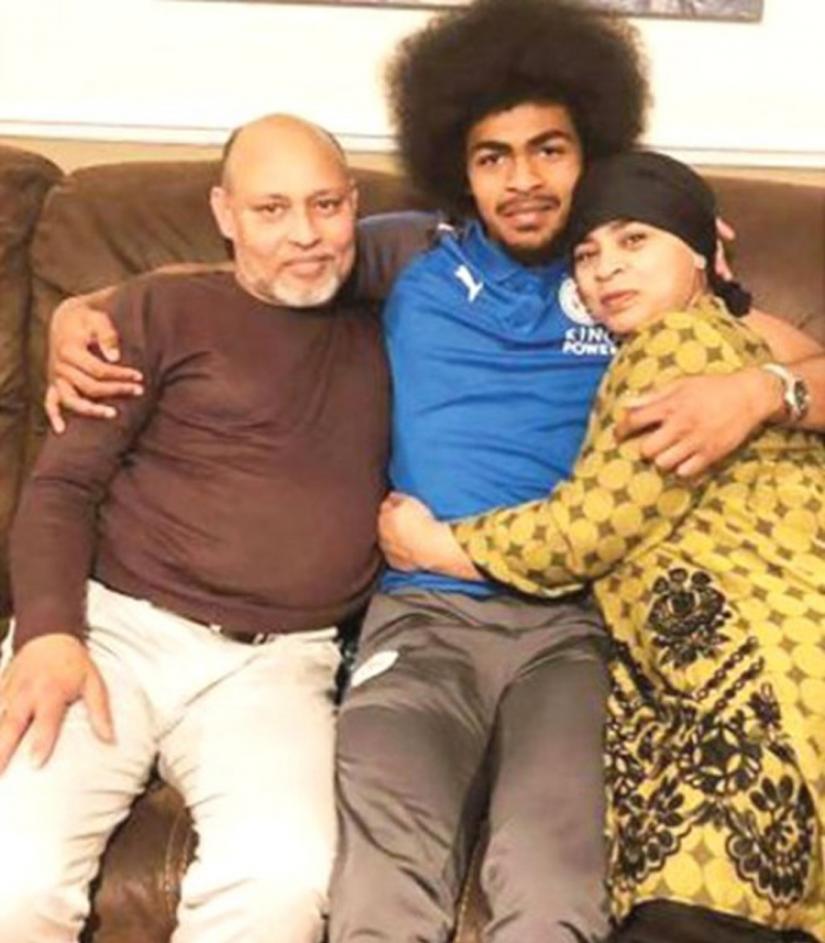 Hamza Choudhury with his mother and step-dad.