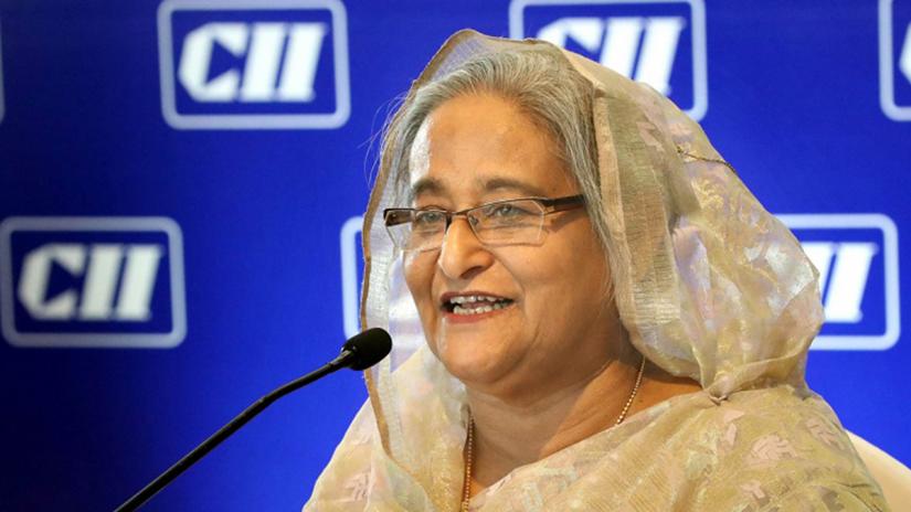 Prime Minister Sheikh Hasina was addressing a function at Kamal Mahal Hall of Hotel ICT Maurya in New Delhi on Friday (Oct 4). FOCUS BANGLA