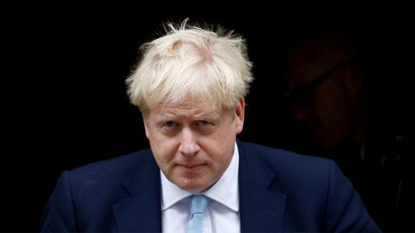 FILE PHOTO: British Prime Minister Boris Johnson leaves his Downing Street office in London, Britain, Oct 3, 2019. REUTERS
