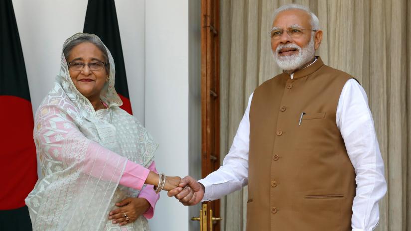 India`s Prime Minister Narendra Modi shakes hands with his Bangladeshi counterpart Sheikh Hasina before their meeting at Hyderabad House in New Delhi, India, October 5, 2019. REUTERS