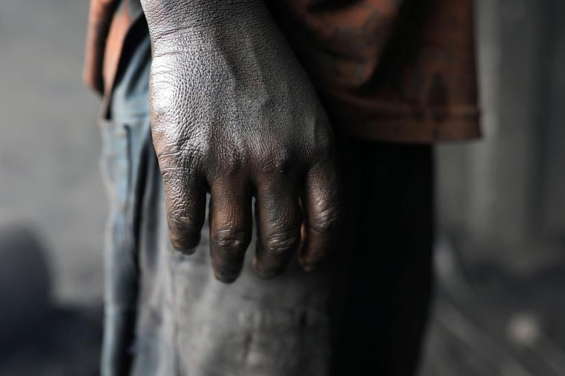 Dirty hand of a child worker is pictured at a dockyard in Dhaka, Bangladesh, September 20, 2018. REUTERS