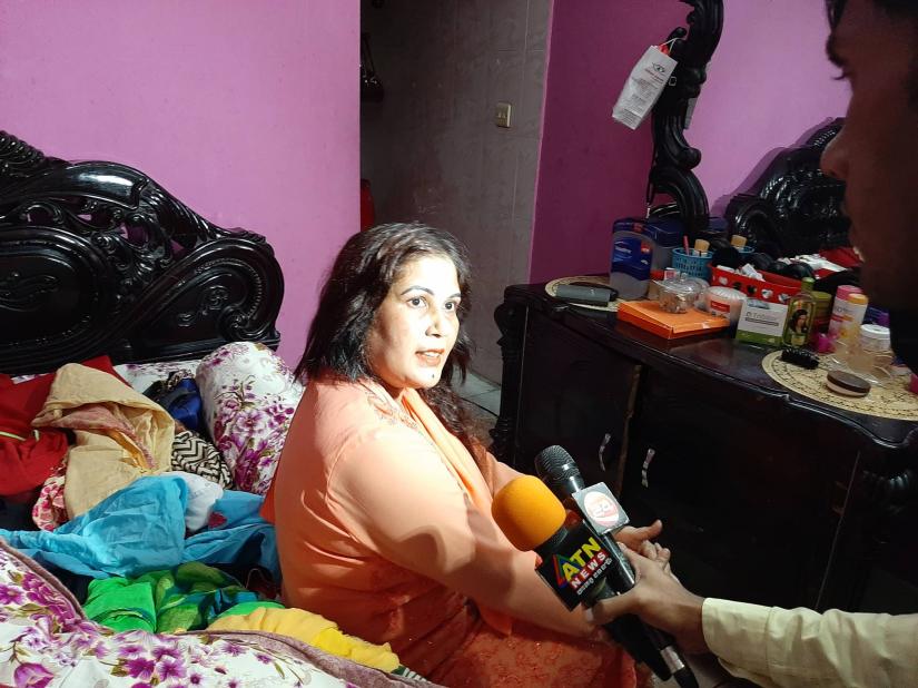 Sharmin Chowdhury, his second wife of Ismail Hossain Chowdhury Samrat, speaks to media during the Rapid Action Battalion raid at Samrat`s Mohakhali residence on Sunday.