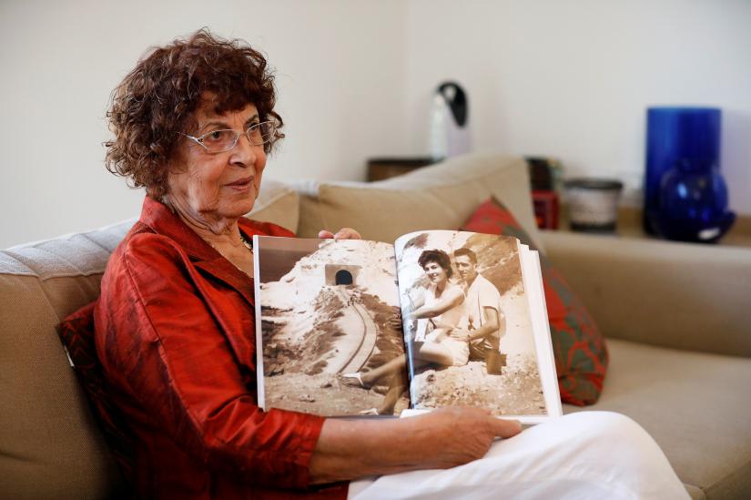 Nadia, widow of Israeli spy Eli Cohen, shows a photograph of herself with her late husband, during an interview with Reuters in Herzliya, Israel October 6, 2019. Picture taken October 6, 2019. REUTERS