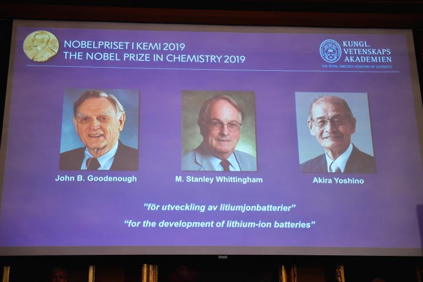 A screen displays the portraits of the laureates of the 2019 Nobel Prize in Chemistry (L-R) John B. Goodenough, M. Stanley Whittingham, and Akira Yoshino `for the development of lithium-ion batteries` during a news conference at the Royal Swedish Academy of Sciences in Stockholm, Sweden, October 9, 2019. TT News Agency/via REUTERS