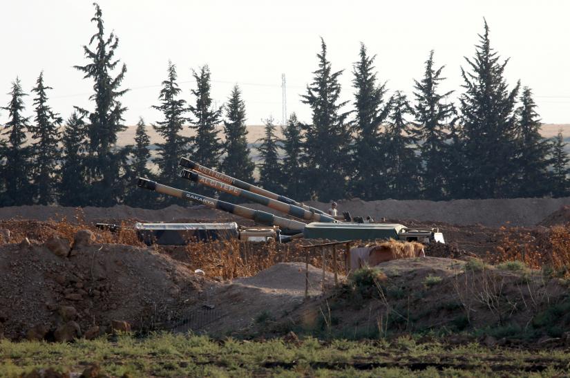 Turkish army howitzers are positioned on the Turkish-Syrian border, near the southeastern town of Akcakale in Sanliurfa province, Turkey, October 7, 2019. REUTERS