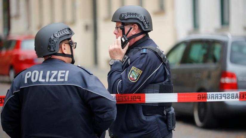 Police officers are seen at the site of a shooting, in which two people were killed, in Halle, Germany Oct 9, 2019. REUTERS