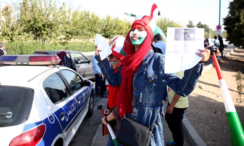 An Iranian fan arrives to attend Iran’s FIFA World Cup Asian qualifier match against Cambodia, as for the first time women are allowed to watch the national soccer team play in over 40 years, at the Azadi stadium in Tehran, Iran October 10, 2019.  WANA (West Asia News Agency) via REUTERS