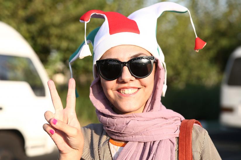 An Iranian woman gestures as she arrives to attend Iran’s FIFA World Cup Asian qualifier match against Cambodia, as for the first time women are allowed to watch the national soccer team play in over 40 years, at the Azadi stadium in Tehran, Iran October 10, 2019.  WANA (West Asia News Agency) via REUTERS