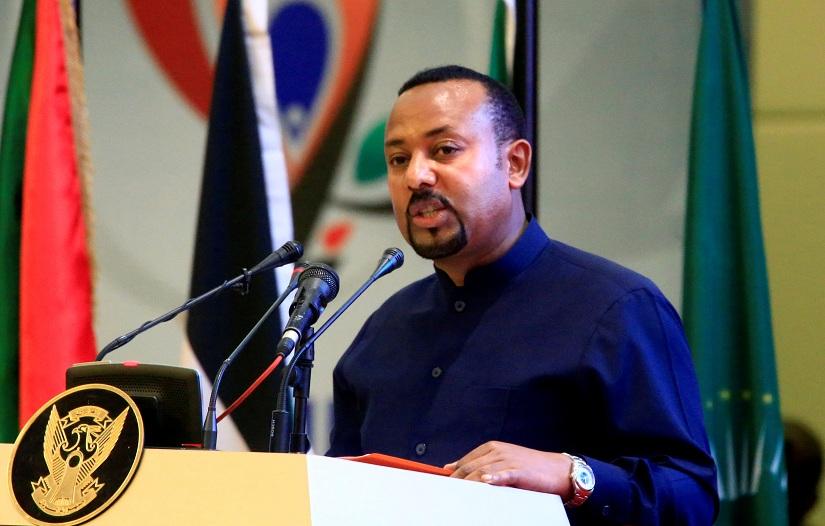FILE PHOTO: Ethiopia`s Prime Minister Abiy Ahmed addresses delegates during the signing of the Sudan`s power sharing deal, that paves the way for a transitional government, and eventual elections, following the overthrow of a long-time leader Omar al-Bashir, in Khartoum, Sudan, Aug 17, 2019. REUTERS