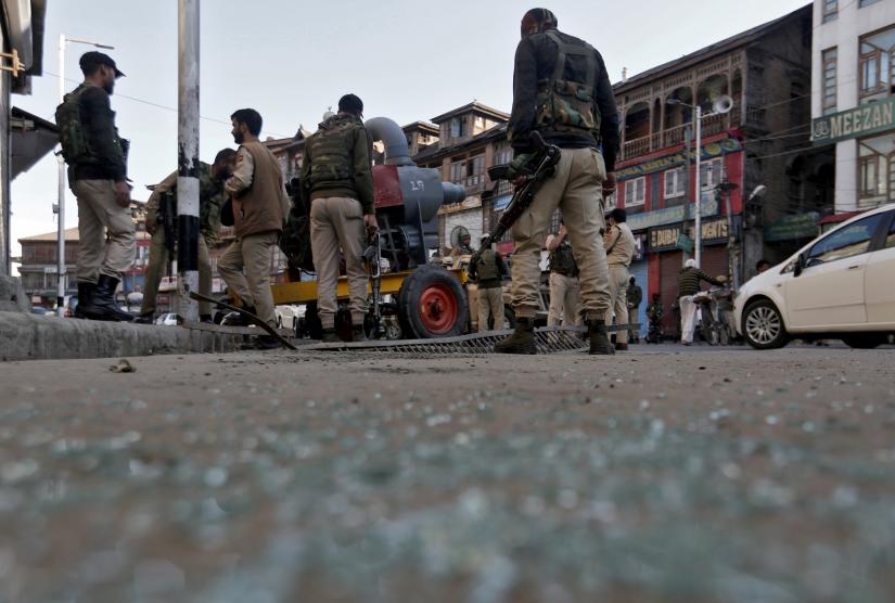 FILE PHOTO: Indian police officers stand at the site of a grenade attack in Srinagar October 12, 2019. REUTERS