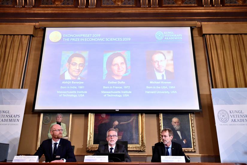 Goran K Hansson (C), Secretary General of the Royal Swedish Academy of Sciences, and academy members Peter Fredriksson (L) and Jakob Svensson, announce the winners of the 2019 Nobel Prize in Economics during a news conference at the Royal Swedish Academy of Sciences in Stockholm, Sweden, October 14, 2019. Abhijit Banerjee, Esther Duflo, and Michael Kremer received the Nobel Prize in Economics. Karin Wesslen/TT News Agency/via REUTERS