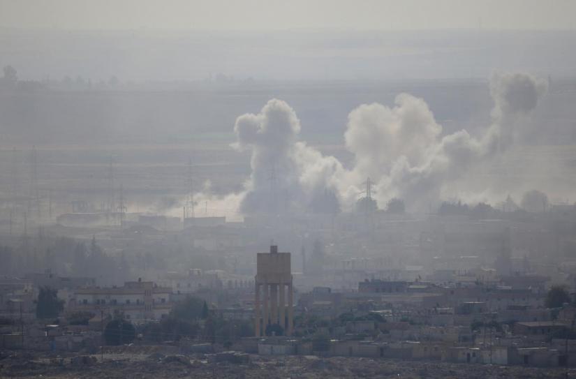 Smoke rises over the Syrian town of Ras al-Ain as seen from the Turkish border town of Ceylanpinar, Sanliurfa province, Turkey, Oct 15, 2019. REUTERS