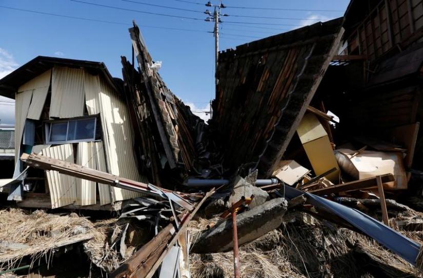 Destroyed houses are seen, in the aftermath of Typhoon Hagibis, in Koriyama, Fukushima prefecture, Japan Oct 15, 2019. REUTERS