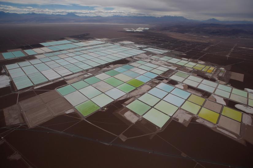 An aerial view shows the brine pools of SQM lithium mine on the Atacama salt flat in the Atacama desert of northern Chile, January 10, 2013. REUTERS/File Photo