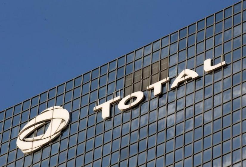 A logo of French oil company Total is seen at an office building in La Defense business district in Courbevoie near Paris, France, October 12, 2019. REUTERS/ File Photo
