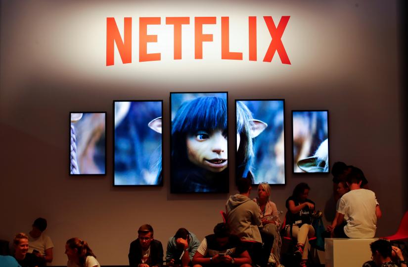 Gamers and visitors take a rest at the booth of Netflix during Europe`s leading digital games fair Gamescom, which showcases the latest trends of the computer gaming scene in Cologne, Germany, August 21, 2019. REUTERS