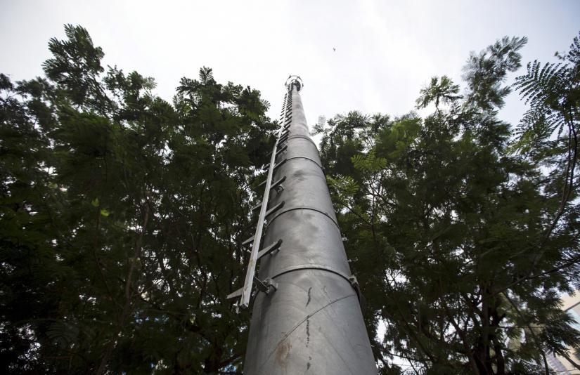 A celltower installed in a public park is pictured in Mumbai March 26, 2015. REUTERS