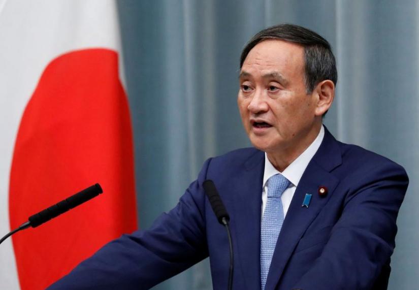 FILE PHOTO: Japan`s Chief Cabinet Secretary Yoshihide Suga speaks at a news conference after the reshuffling of the Japanese cabinet at Prime Minister Shinzo Abe`s official residence in Tokyo, Japan September 11, 2019. REUTERS