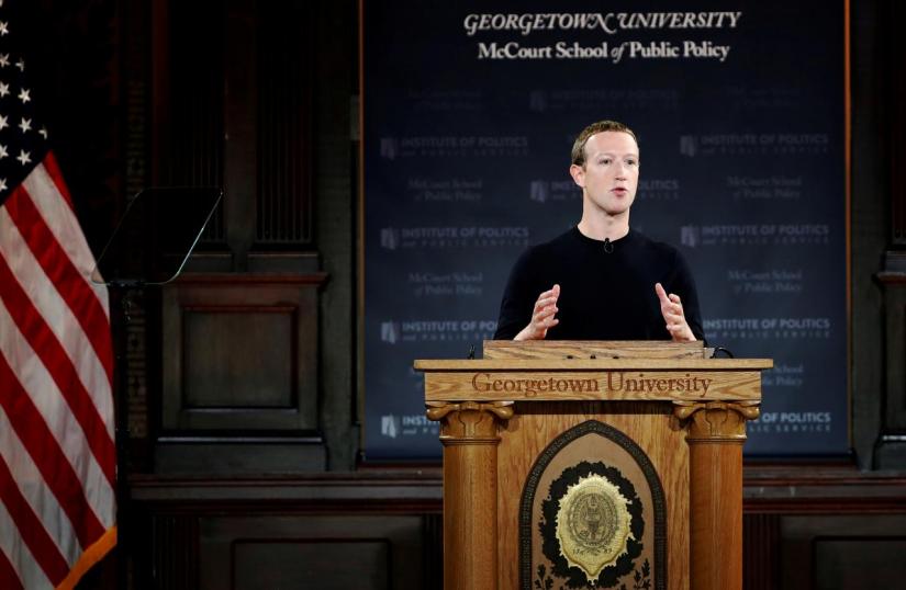 Facebook Chairman and CEO Mark Zuckerberg addresses the audience on `the challenges of protecting free speech while combating hate speech online, fighting misinformation, and political data privacy and security,` at a forum hosted by Georgetown University`s Institute of Politics and Public Service (GU Politics) and the McCourt School of Public Policy in Washington, US, Oct 17, 2019. REUTERS