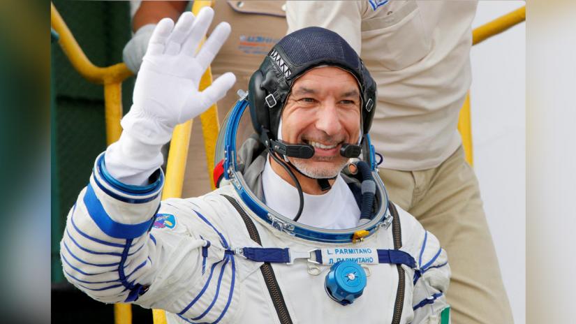 FILE PHOTO: Italian astronaut Luca Parmitano, crew member of the mission to the International Space Station (ISS), waves as he boards prior the launch of Soyuz MS-13 spacecraft Baikonur cosmodrome, Kazakhstan, Jul 20, 2019.