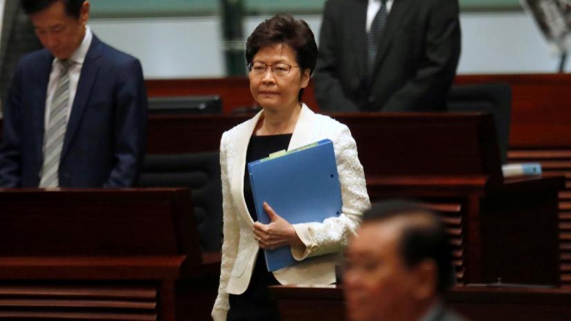 FILE PHOTO: Hong Kong`s Chief Executive Carrie Lam arrives to answer questions from lawmakers regarding her policy address, at the Legislative Council in Hong Kong, China Oct 17, 2019. REUTERS