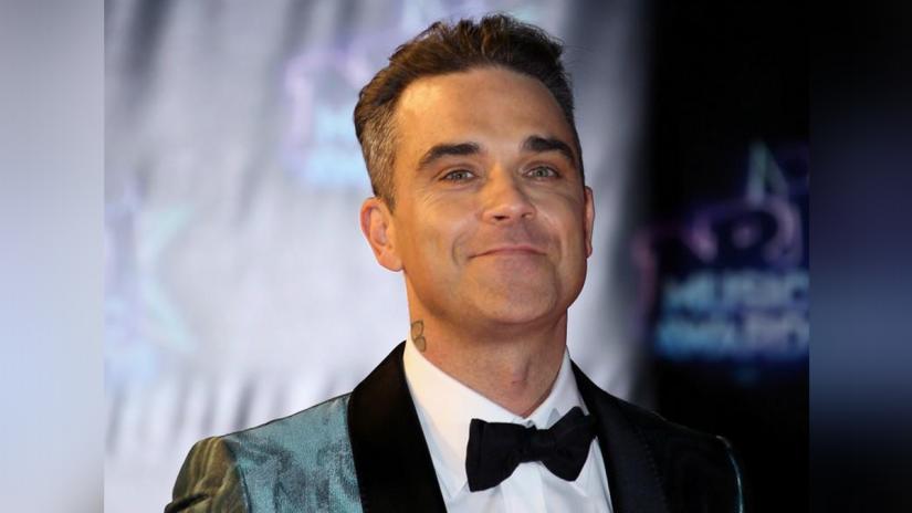 FILE PHOTO: Singer Robbie Williams arrives to attend the NRJ Music Awards ceremony at the Festival Palace in Cannes, France, Nov 12, 2016. REUTERS