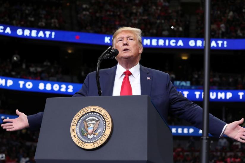 FILE PHOTO: US President Donald Trump reacts during a campaign rally in Dallas, Texas, US, Oct 17, 2019. REUTERS