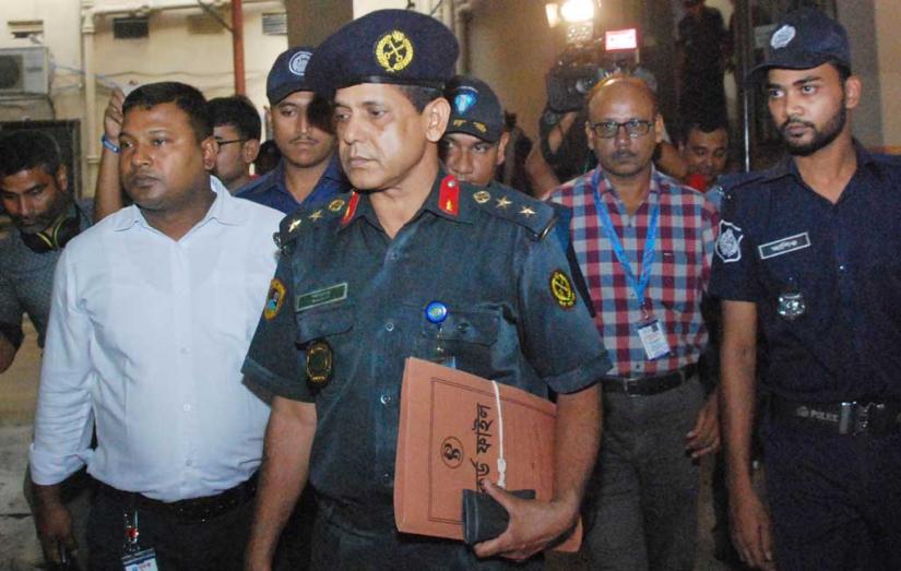 ACC officials escort Deputy Inspector General (DIG) of Prisons Bazlur Rashid, for amassing assets worth Tk3.08crore illegally, on Sunday, Oct 20, 2019 FOCUS BANGLA
