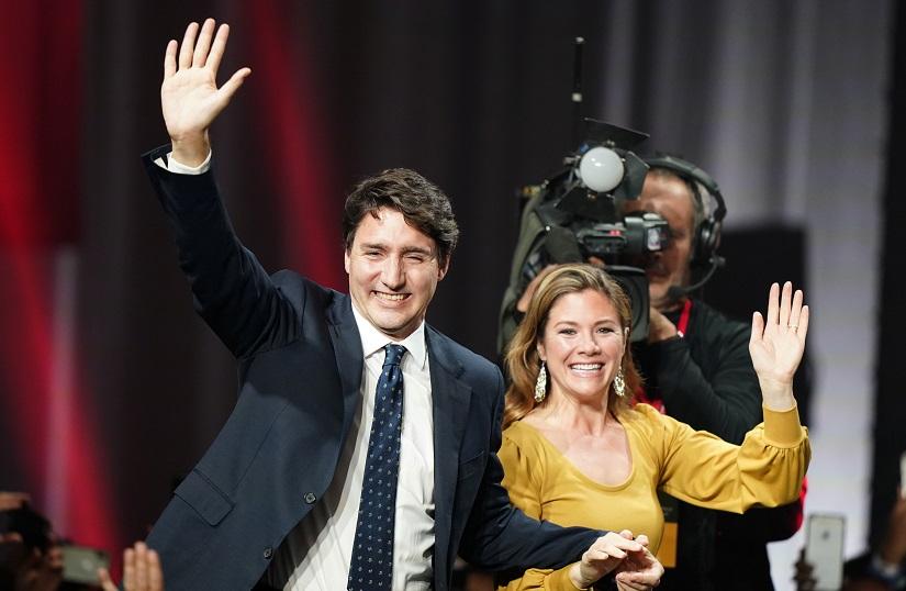 Liberal leader and Canadian Prime Minister Justin Trudeau and his wife Sophie Gregoire Trudeau wave to supporters after the federal election at the Palais des Congres in Montreal, Quebec, Canada Oct 22, 2019. REUTERS
