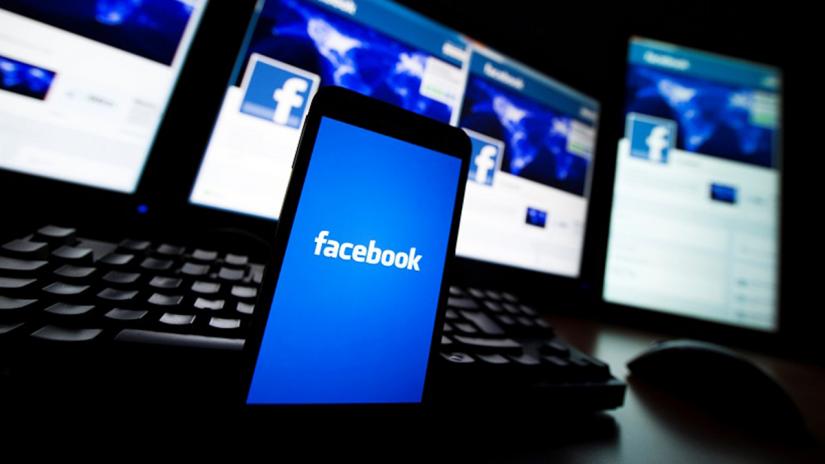FILE PHOTO: The loading screen of the Facebook application on a mobile phone is seen in this photo illustration taken in Lavigny May 16, 2012. REUTERS