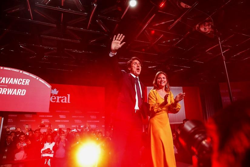 Liberal leader and Canadian Prime Minister Justin Trudeau waves to supporters beside his wife Sophie Gregoire Trudeau after the federal election at the Palais des Congres in Montreal, Quebec, Canada Oct 22, 2019. REUTERS