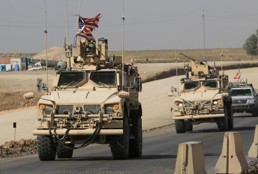 A convoy of US vehicles is seen after withdrawing from northern Syria, at the Iraqi-Syrian border crossing in the outskirts of Dohuk, Iraq, Oct 21, 2019. REUTERS